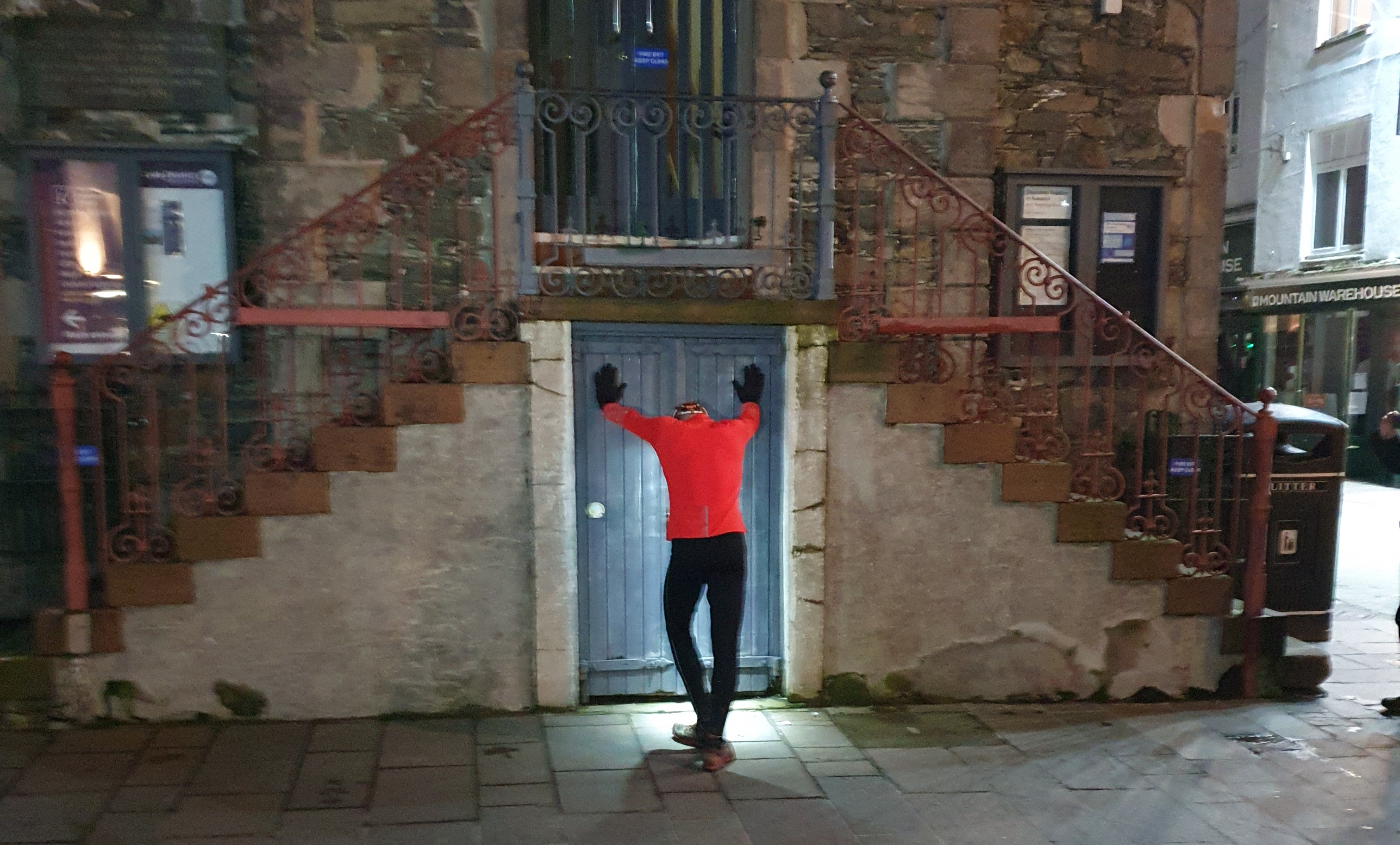 Andrew leaning against the Moot Hall on completing his Bob Graham Round.