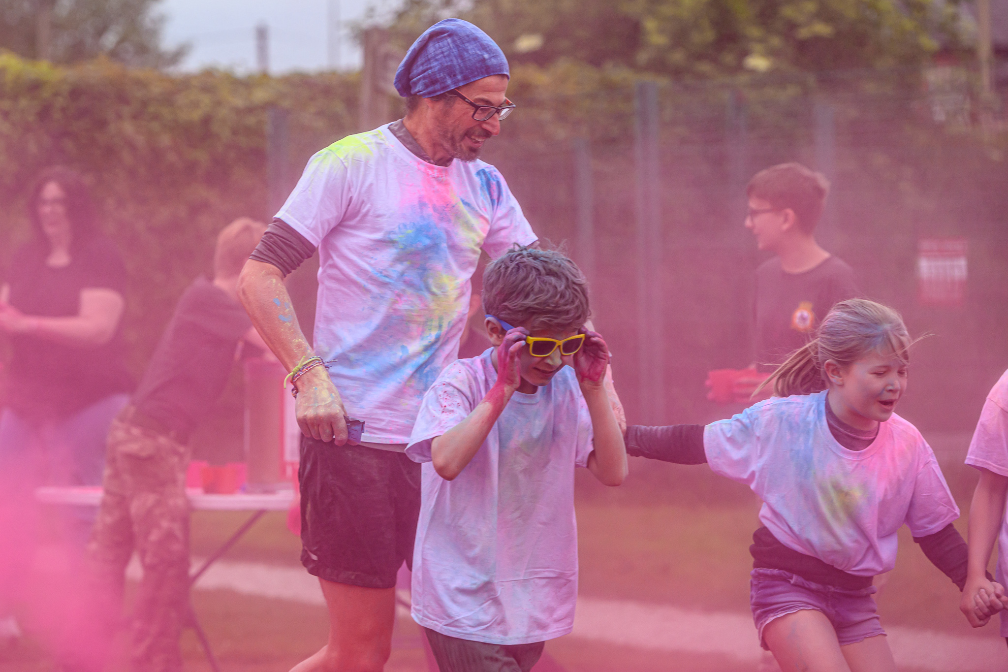 Clouds of coloured dye as runners try to pass.