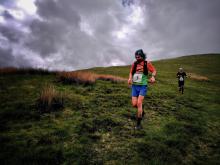 Two runners on a fell.